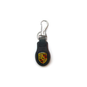 chaveiro, chaveiro automotivo, chaveiro PVC injetado, chaveiro automotivo texturizado com logomarca metalizada, chaveiro automotivo resinado no verso, chaveiro mosquete e argola de metal, chaveiro automotivo gravação redonda, chaveiro gravação digital em vinil autoadesivo um lado, chaveiro com logomarca metalizada, chaveiro acabamento resina epóxi cristal, chaveiro automotivo preto, comprar chaveiro automotivo no rio de janeiro, chaveiro porsche